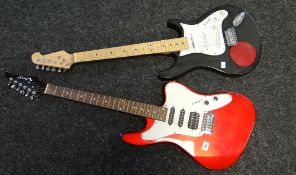 A red and white Woody electric guitar and an unnamed black electric guitar