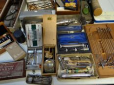 A collection of boxed/cased surgical instruments and related items, and a collection of old GP's