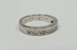 An 18ct white gold half-hoop diamond eternity ring, 5.24gms
