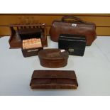 Sundry GP items including a Gladstone-type Doctor-on-call leather bag, a dispensary glasses stand, a