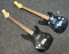 Two child-size black Encore electric guitars
