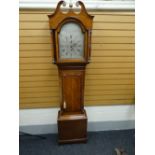 A late eighteenth century oak-cased eight-day Scottish longcase-clock having an arched silvered dial