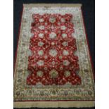 Red ground Kashmir rug, Ziegler design, 170 x 120 cms