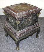 A modern ornate box-on-stand with exotic carving, 63cms