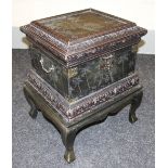 A modern ornate box-on-stand with exotic carving, 63cms