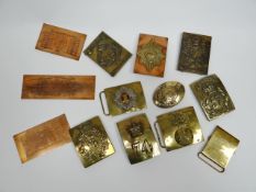 A quantity of brass and copper regimental insignia plates