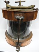 A large copper and brass masthead lamp marked 'Meteorite C23617'