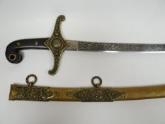 A Mameluke-style British sword with Arabic engravings dated 1895 and decorative shamrock, thistle