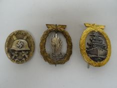 A Nazi German Minesweeping badge together with a Destroyer Kriegsmarine badge and Wound Badge