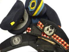 A quantity of berets and caps to include Scottish Highland headwear