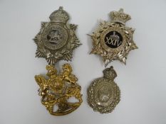 Four regimental helmet plates