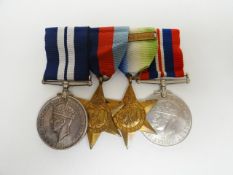 WWII D.S.M. Group of 4 medals to Sig. J. Lisle, H.M.S. Cockatrice, R.N. Consisting of: Distinguished