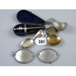 A cased white metal Champagne tap, a pair of oval white metal spirit labels - 'His Lordship's