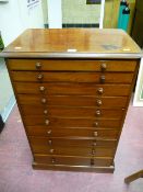 A late Victorian mahogany collector's chest of ten graduated drawers with turned wooden knobs on a