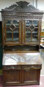Good late 19th Century oak bureau bookcase having five pane glazed doors to the top with open