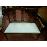 An Edwardian inlaid mahogany two seater couch with shaped back rail with line inlaid decoration over