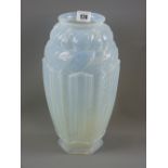 A Joblings relief moulded art glass vases with a top double band of flowers and leaves above an