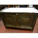 An 18th Century oak two drawer dresser base, inset panel sided and back with interior chamfers,