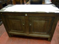 An 18th Century oak two drawer dresser base, inset panel sided and back with interior chamfers,