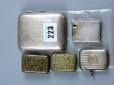 A silver cigarette case and a parcel of four silver/white metal vestas and a cigarette lighter