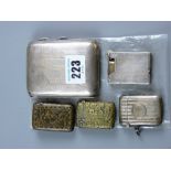 A silver cigarette case and a parcel of four silver/white metal vestas and a cigarette lighter