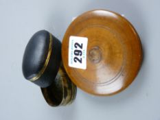 A circular olive wood gentleman's lidded travelling mirror and an early oval black leather and brass