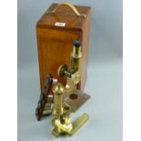 A mahogany cased all brass microscope by Ross with four supplementary lenses