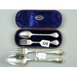 A cased silver fork and spoon pair, each piece with shaped and decorated handles, 2 ozs, London 1862