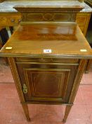 A circa 1900 mahogany single door night cabinet, crossbanded and line inlaid mahogany top with fancy