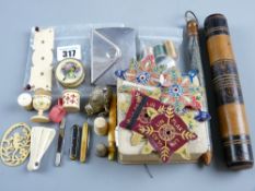 A parcel of ivory and other sewing items, a miniature bone/ivory folding fan and an intricate