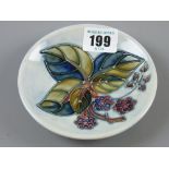 A Moorcroft Blackberry pin dish, mottled light blue ground, blue underglaze impressed marks, 11.5