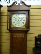 A 19th Century oak longcase clock, the hood with broken swan neck pediment and carved square pillars