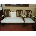 A good quality mahogany and inlaid two seater couch with matching armchair, carved entwined lyre