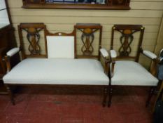 A good quality mahogany and inlaid two seater couch with matching armchair, carved entwined lyre