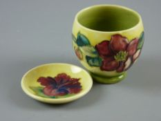 A Moorcroft yellow ground small floral pot with Queen Mary label to the base, 7 cms high and a small