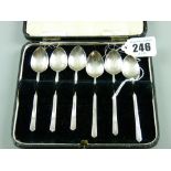 A cased set of six Arts & Crafts style silver coffee spoons, Sheffield 1957