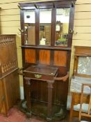 An Edwardian mahogany mirrored hallstand with horn coathangers and brass side hooks, central