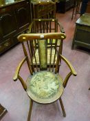 A spindleback circular seated farmhouse armchair, an inlaid mahogany bedroom chair with wicker