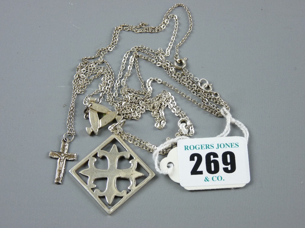 A white metal crucifix and chain, a small triangular silver pendant and chain and a square Celtic