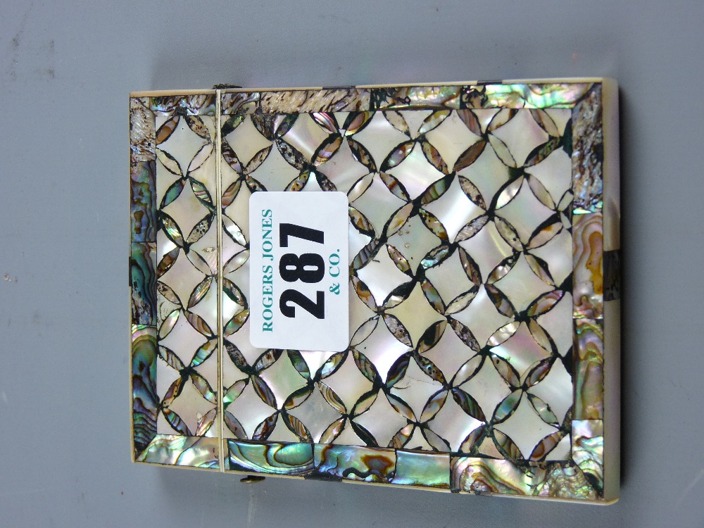 A mother of pearl and abalone card case of small diamond panels with silver mount to the lid and end