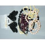 A buckle of tiny French jet beads, a twin strand bead necklace and various other pearl and black