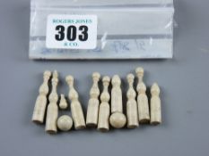 A set of miniature turned bone skittles and balls