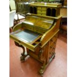 A super quality walnut Victorian piano top Davenport with patent pop-up top rising to reveal a