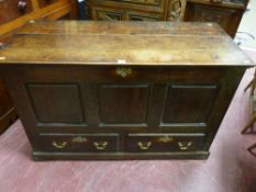 An 18th Century oak panel sided mule chest, polished three plank lift-up lid with iron lock and