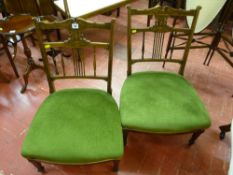 A pair of early Edwardian rosewood and inlaid bedroom chairs with turned spindle gallery back,