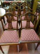 A reproduction set of eight (six plus two) mahogany dining chairs with pierced splat and
