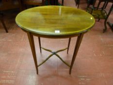 An Edwardian oval topped mahogany and crossbanded side table with boxwood strung slender tapering