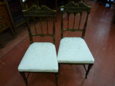 A good pair of walnut carved side chairs with classical architectural style backs, broken swan