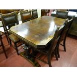 An oak draw leaf dining table and six chairs, carved edge table with cut-off corners and carved