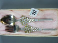A Danish silver fork and spoon pair, each piece with amber decoration, each piece marked A Michelsen
